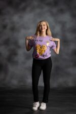 You Are Loved Lilac Tee with yellow African print heart, scattered stars, and red lips from L’Africaine Boutique.