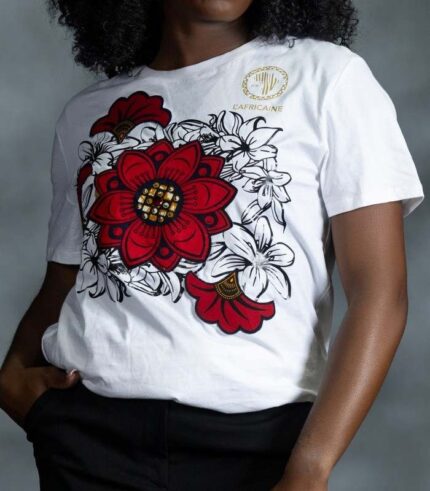 Floral Garden Tee with red blossoms, golden rhinestones, and black-outlined white petals from L’Africaine Boutique.