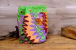 ankara sequin bucket bag in multicolor Ankara wax fabric with zigzag print, green faux leather trim, gold chain strap, and sequin bow embellishment.
