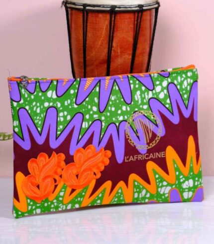 Ankara tropical blaze clutch in green, purple, and burgundy Ankara wax fabric with orange embroidered appliqués, sleek silhouette, and gold boutique logo.